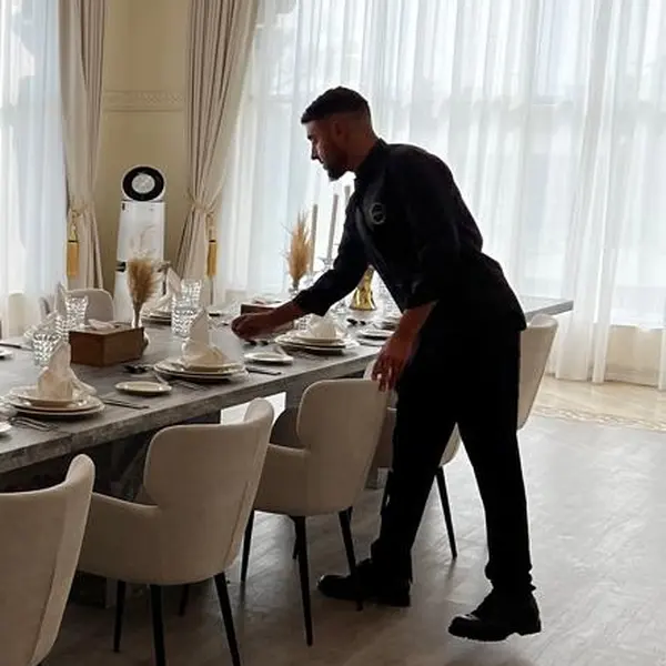 A member of our team setting the table